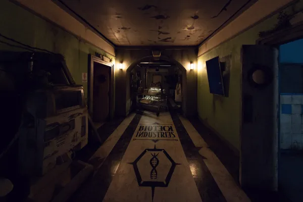Dark, eerie hallway in a haunted house with industrial decor.